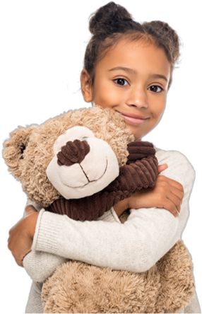A child hugging a teddy bear. 